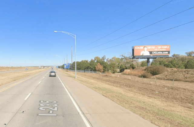 South facing static billboard on I-235, 1-2 blocks south of Kellogg.