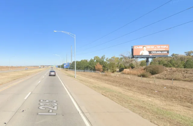 South facing static billboard on I-235, 1-2 blocks south of Kellogg.