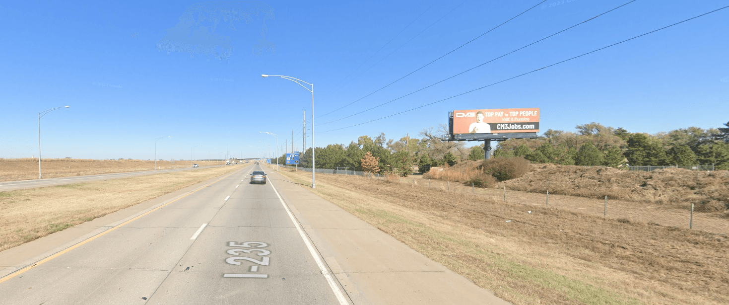 South facing static billboard on I-235, 1-2 blocks south of Kellogg.