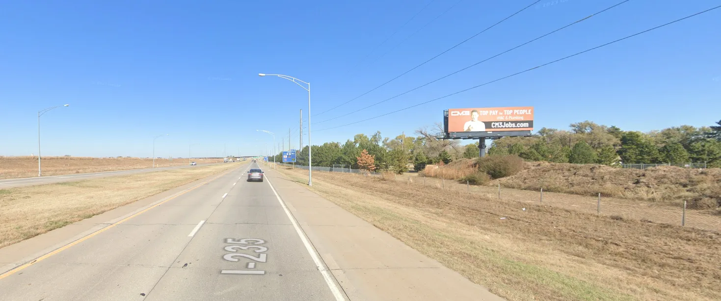 South facing static billboard on I-235, 1-2 blocks south of Kellogg.